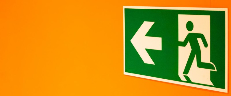 Fire Exit Sign on yellow wall